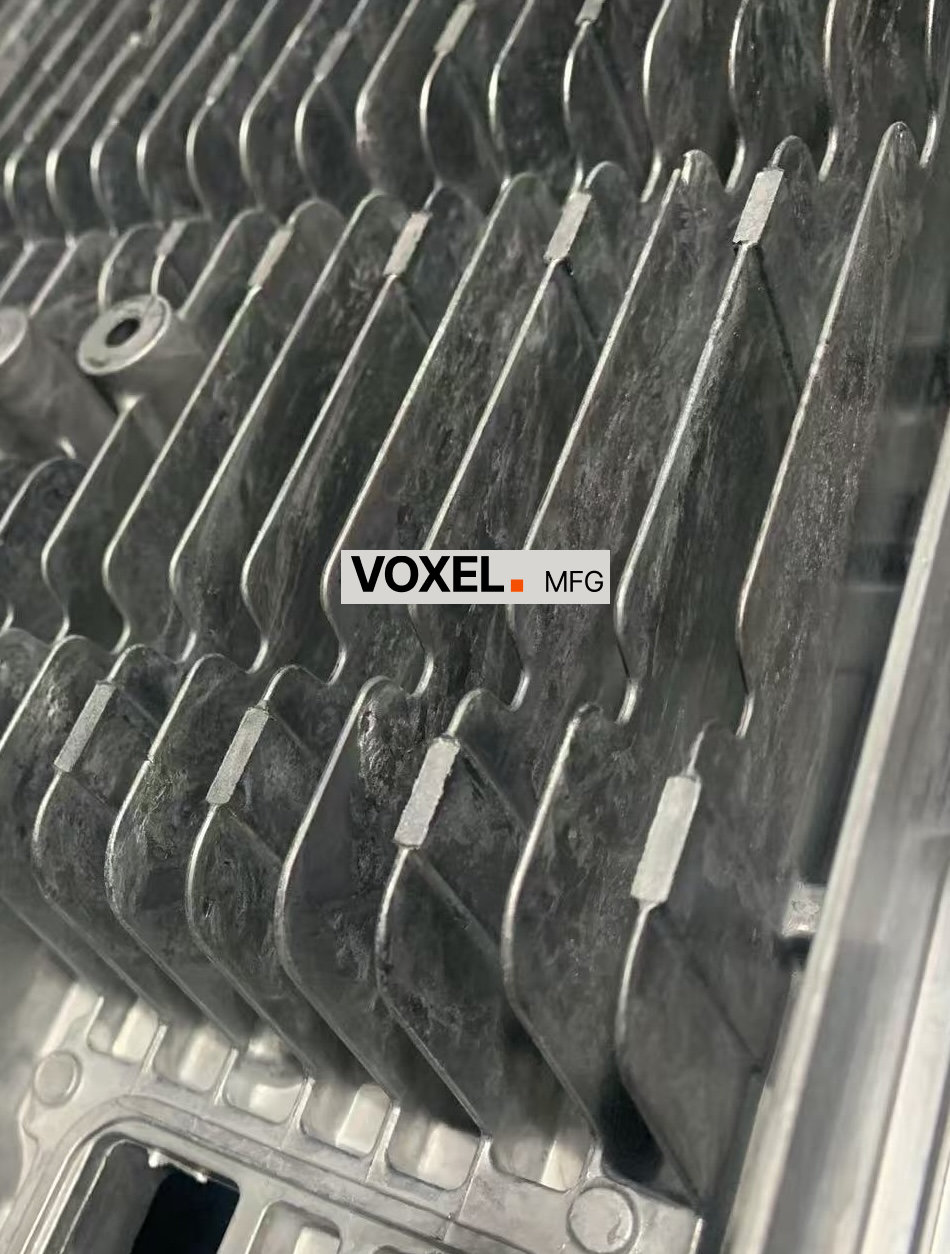 Defective fin fill and porosity in the initial die-casting trial